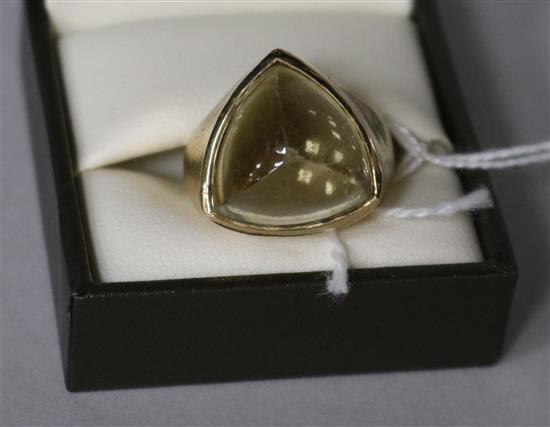 A stylish unmarked textured yellow metal (tests as 14ct) and quartz? set ring, size Q.
